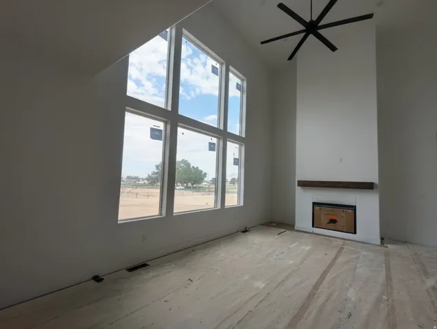 Soaring ceilings with a contemporary black ceiling fan