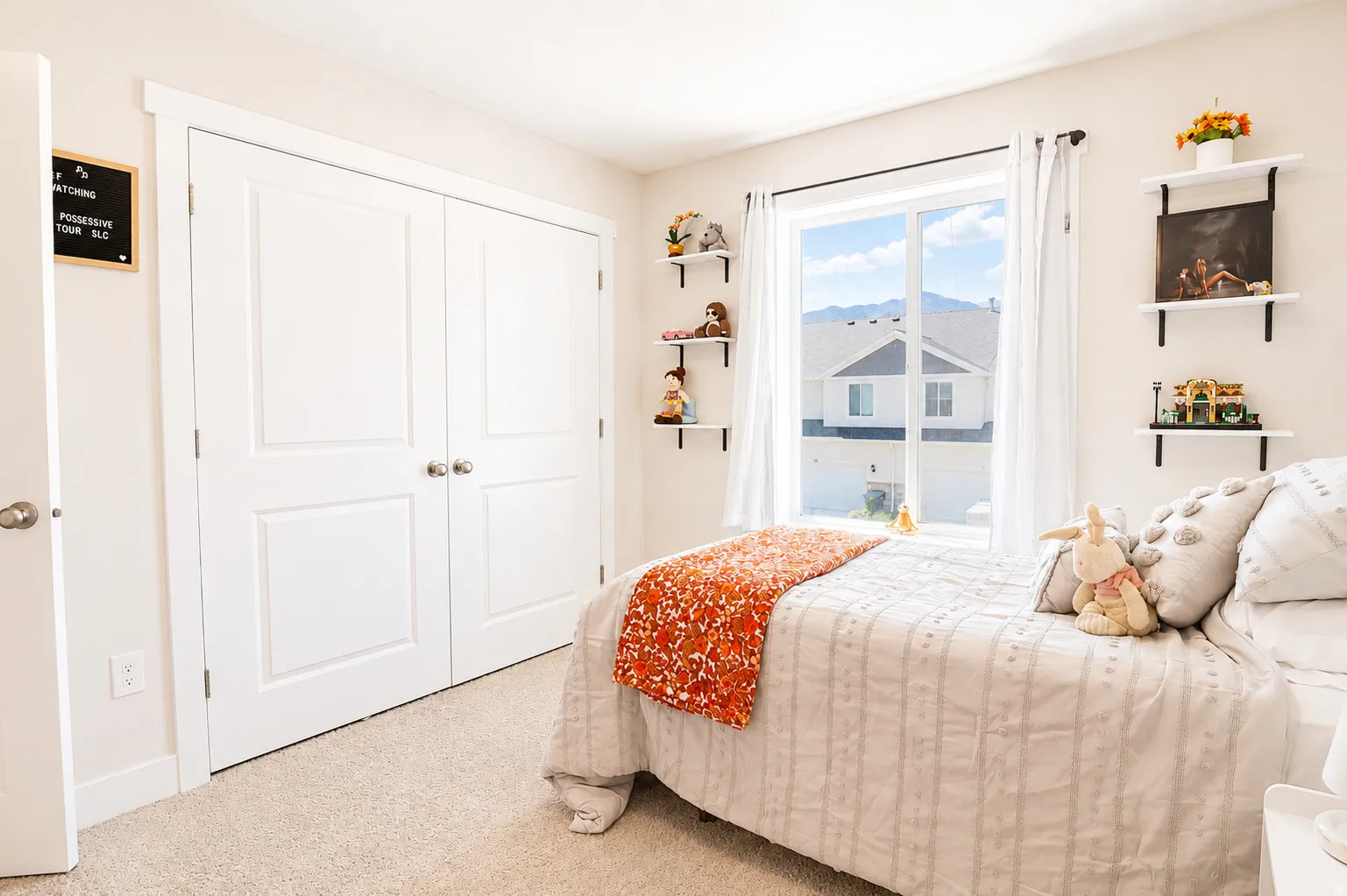 Bedroom featuring neutral carpeting and light-colored walls