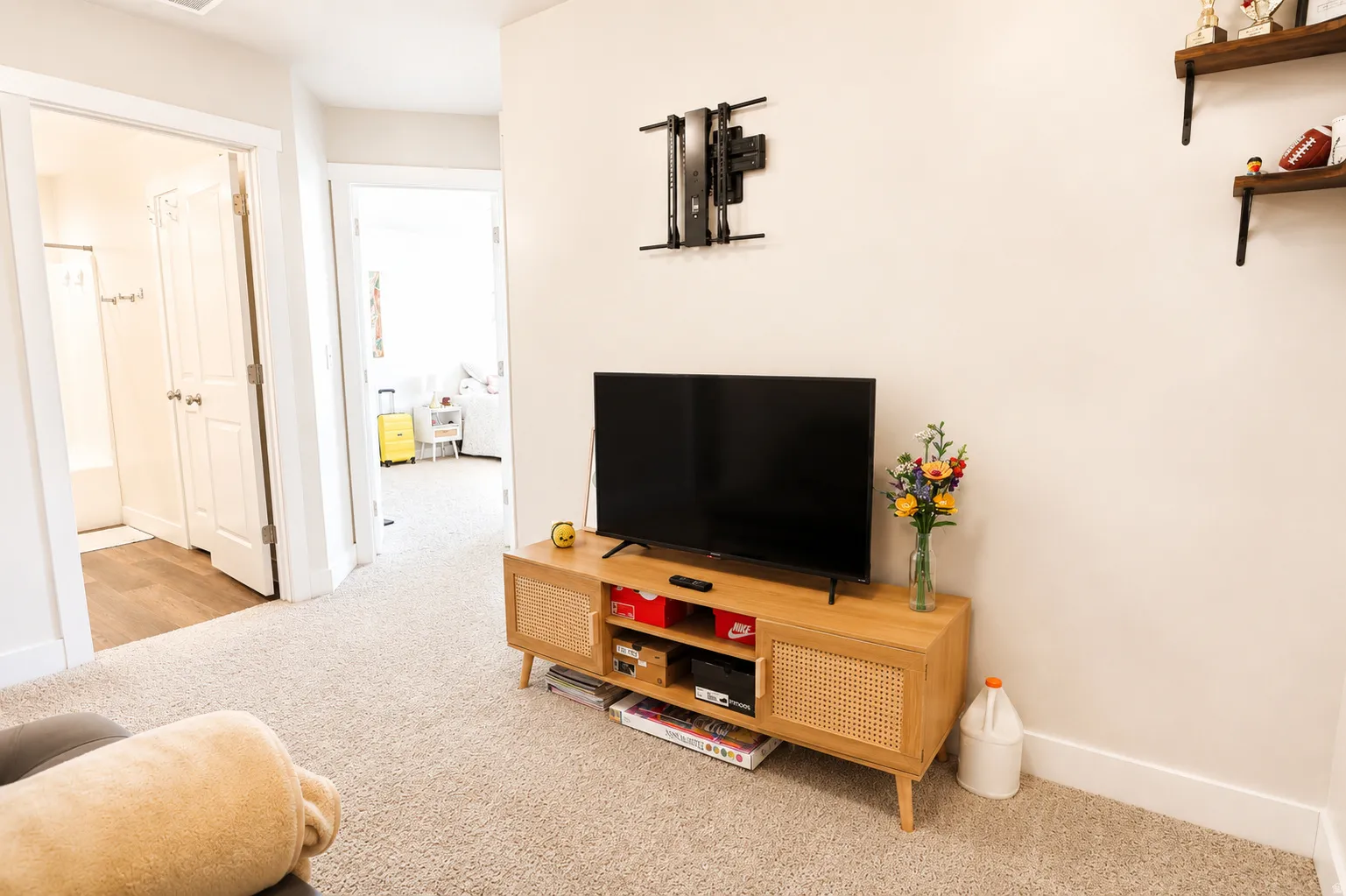 Neutral-toned walls complement the light-colored carpeting
