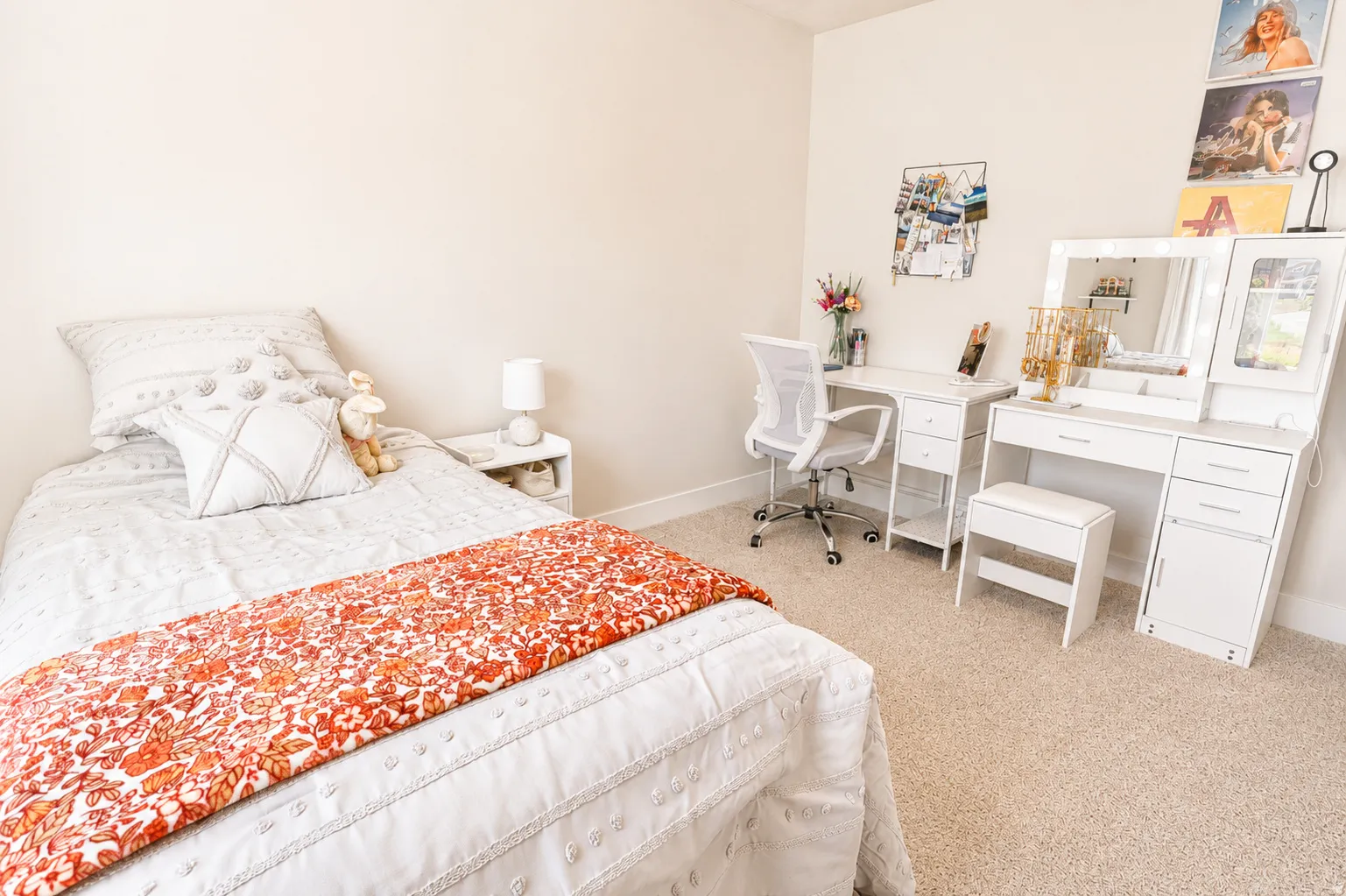 Carpeted bedroom featuring neutral wall tones and a built-in closet