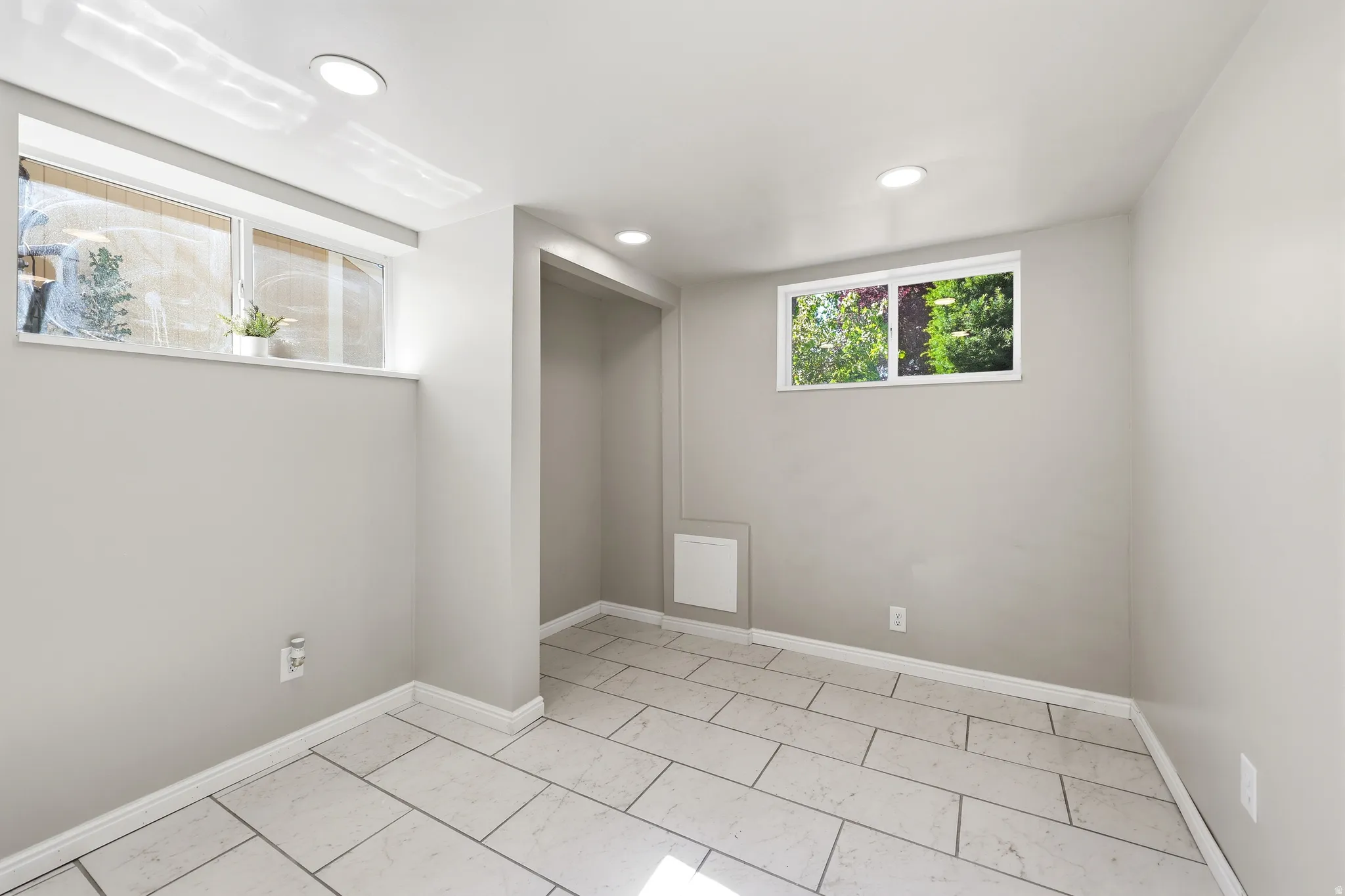 Light gray painted walls with white trim and recessed lighting