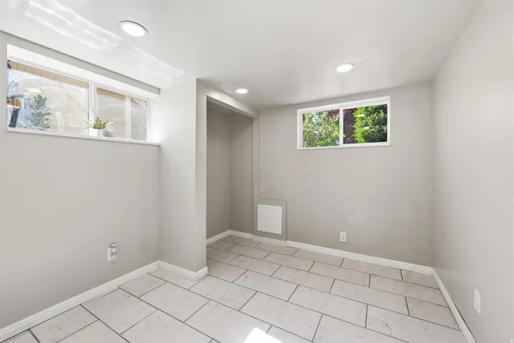 Light gray painted walls with white trim and recessed lighting