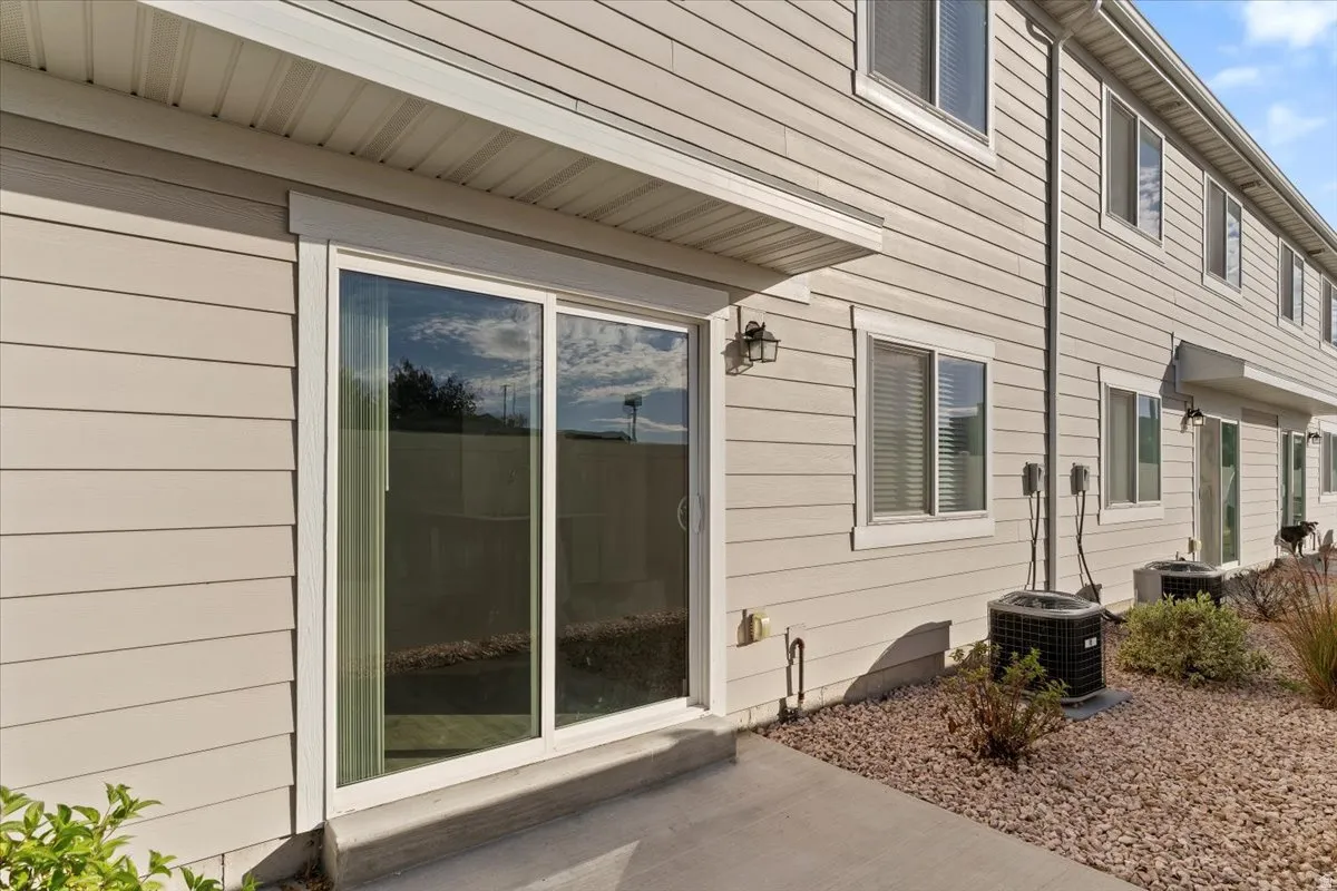 Sliding glass door leading to a concrete patio