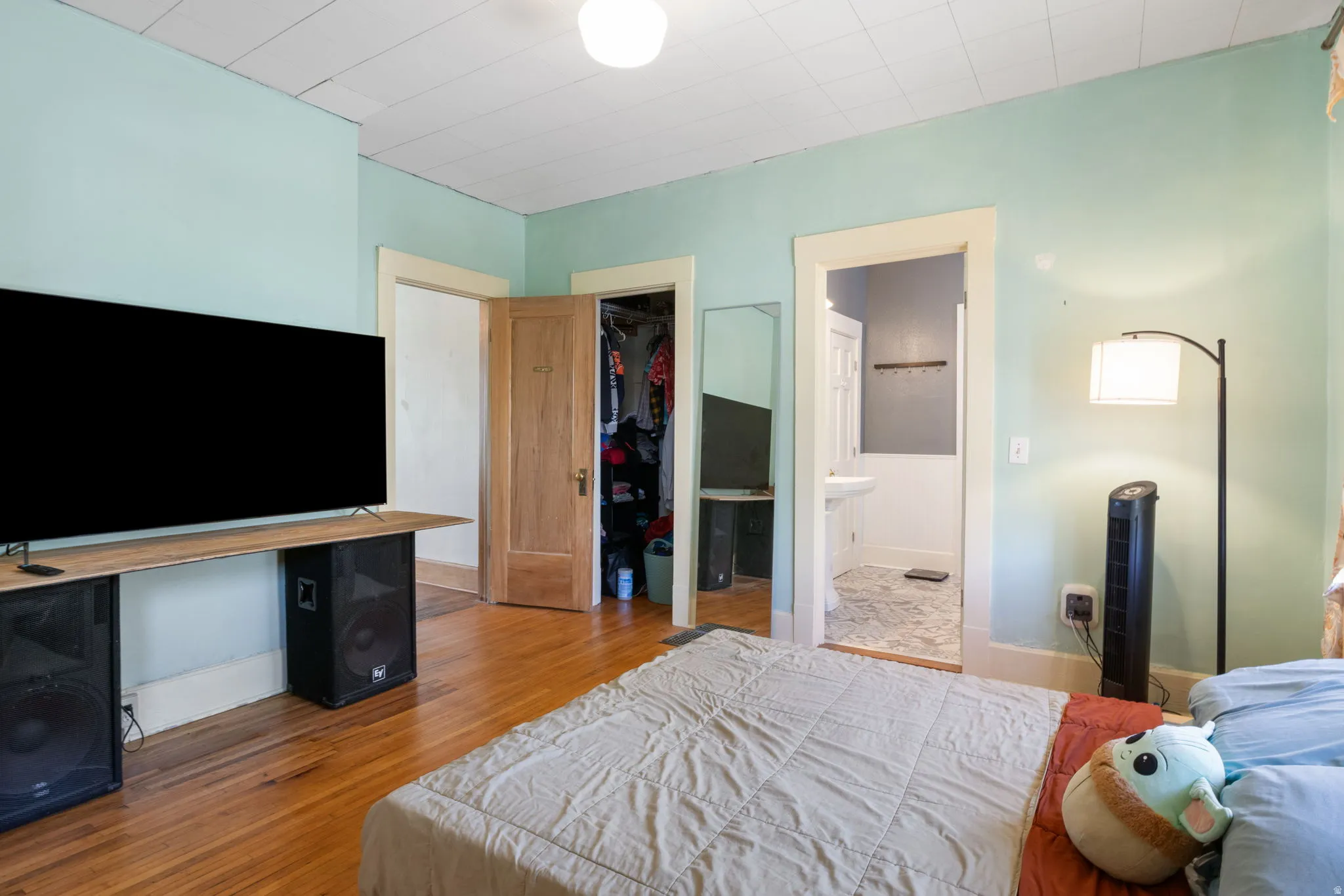 Room featuring hardwood flooring and light blue walls