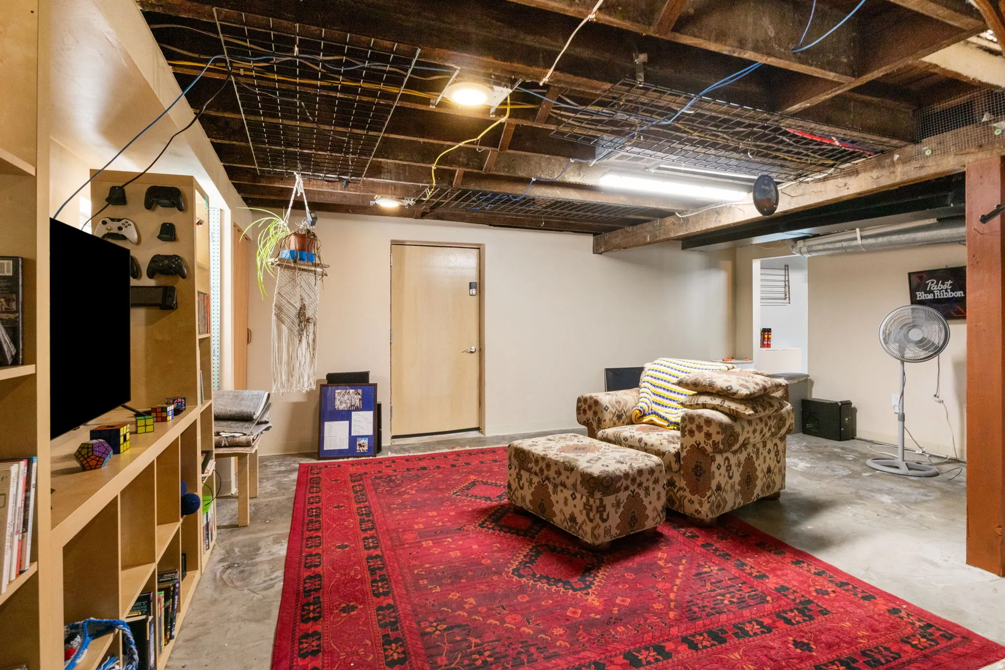 Finished concrete flooring with exposed wood beam ceiling