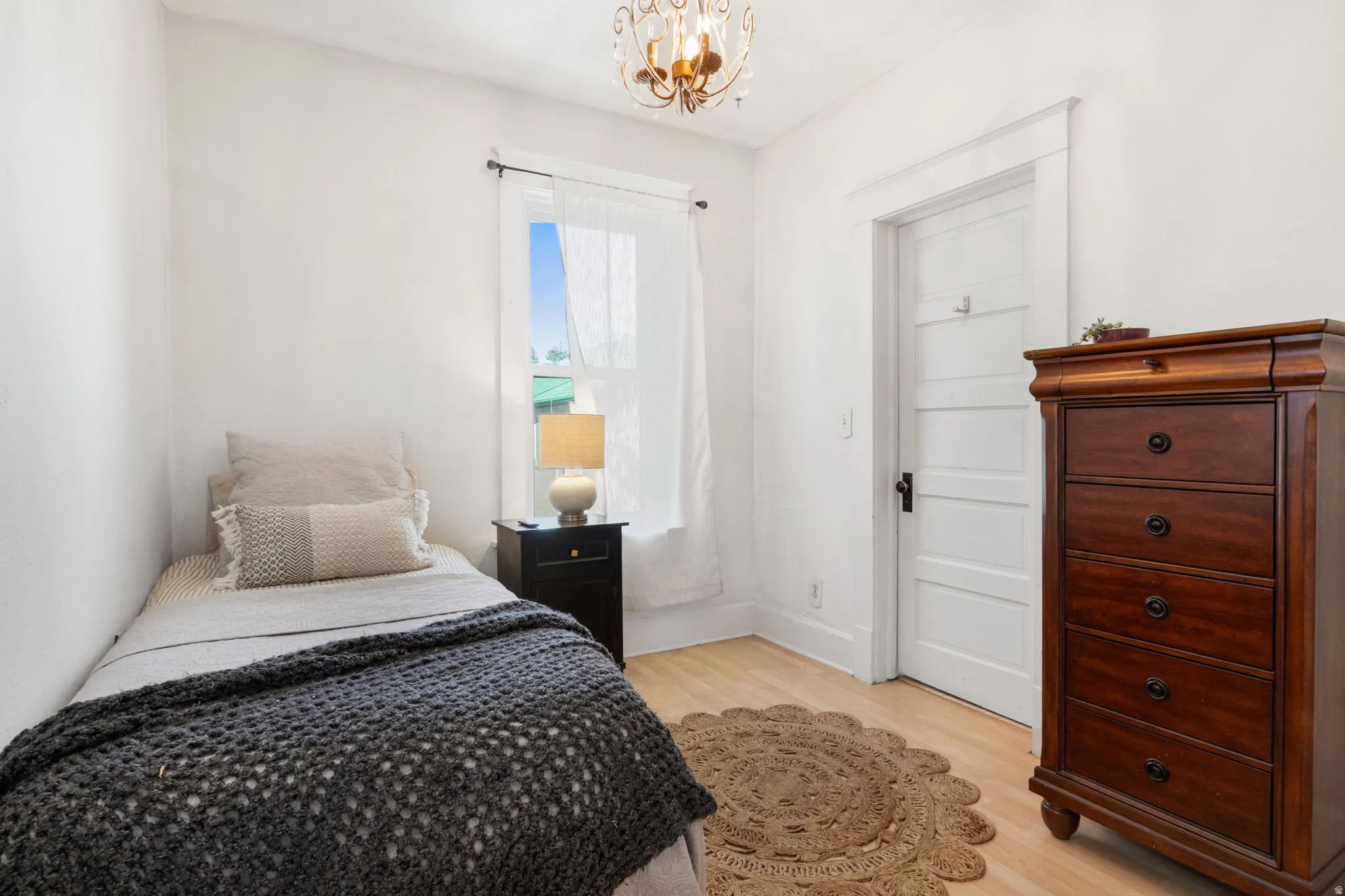 Hardwood-finish flooring and white walls define this room