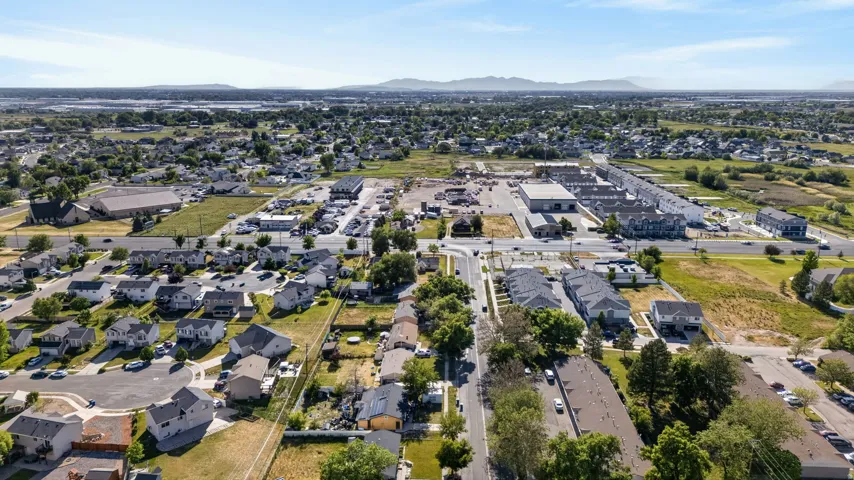 Expansive aerial perspective showcasing a residential neighborhood with a mix of single-family homes and multi-unit dwellings