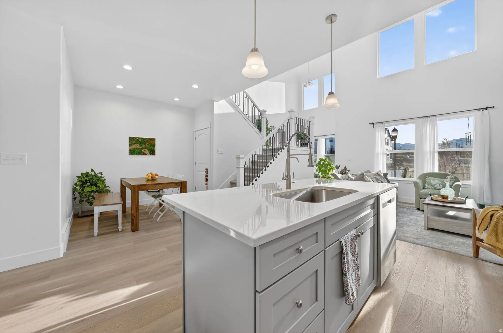 Modern kitchen island with a double basin sink and a stainless steel faucet