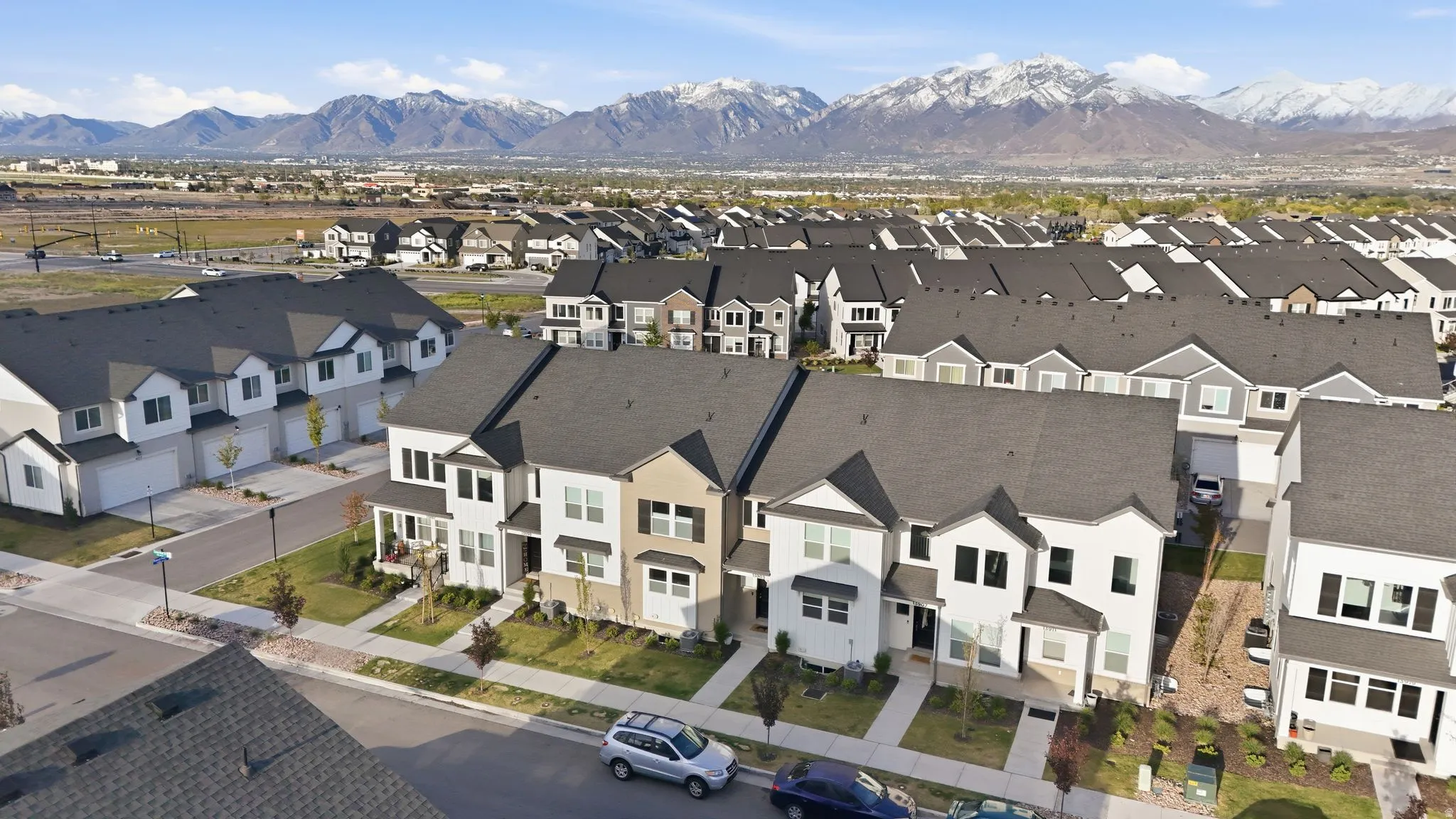 Townhome community featuring contemporary architecture and a mountainous backdrop