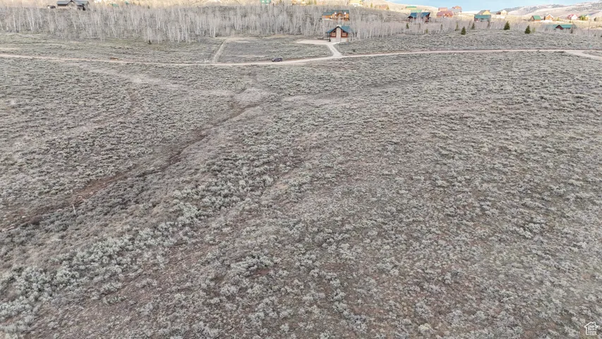 Expansive open land featuring natural sagebrush and a gentle slope