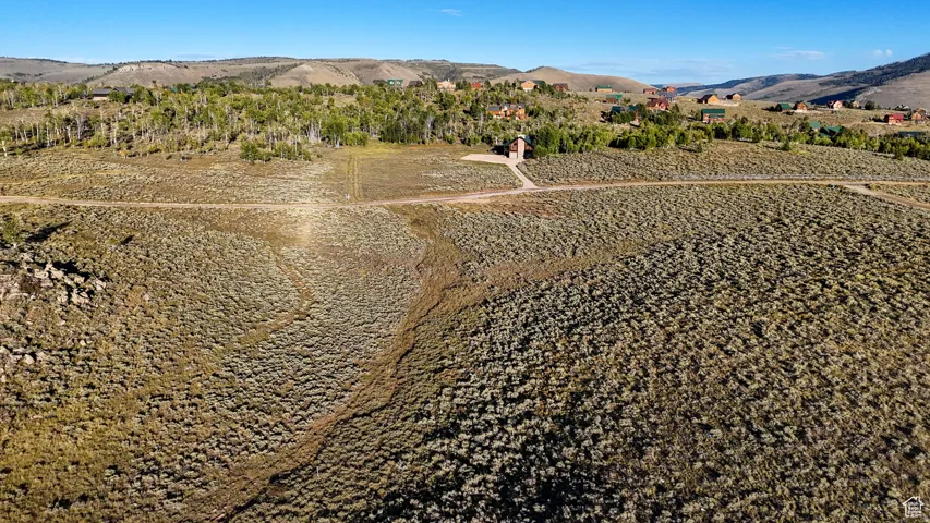 Expansive undeveloped land featuring natural vegetation and rolling terrain