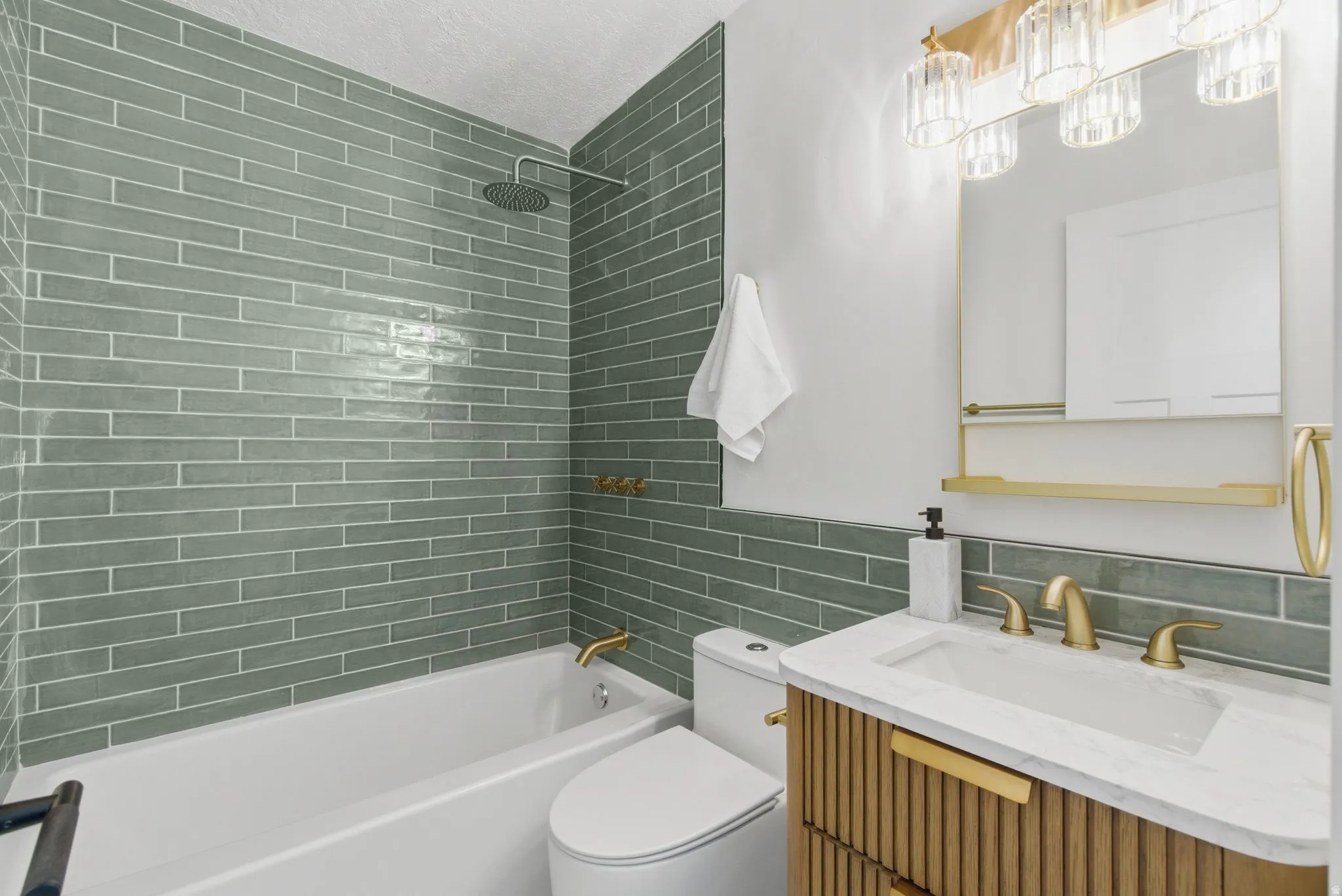 Bathroom featuring a white soaking tub, green subway tile shower surround, and a rain shower head