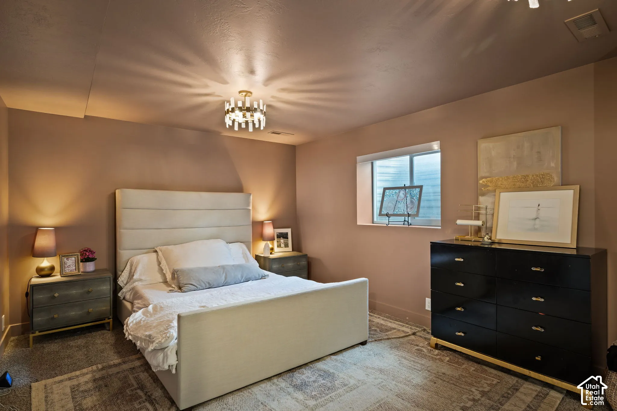Recessed window framing, textured ceiling, and neutral wall paint