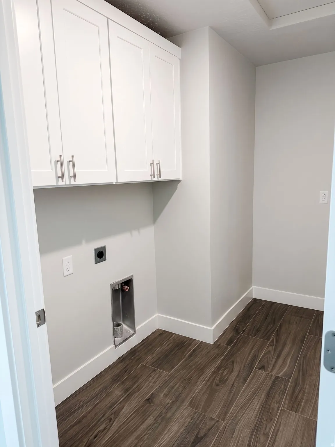 White shaker cabinetry with brushed nickel hardware