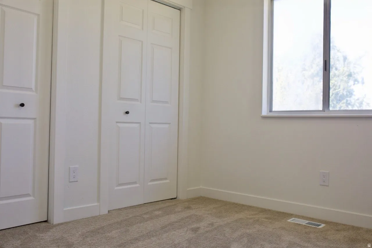 Neutral wall tones with a window providing ambient light