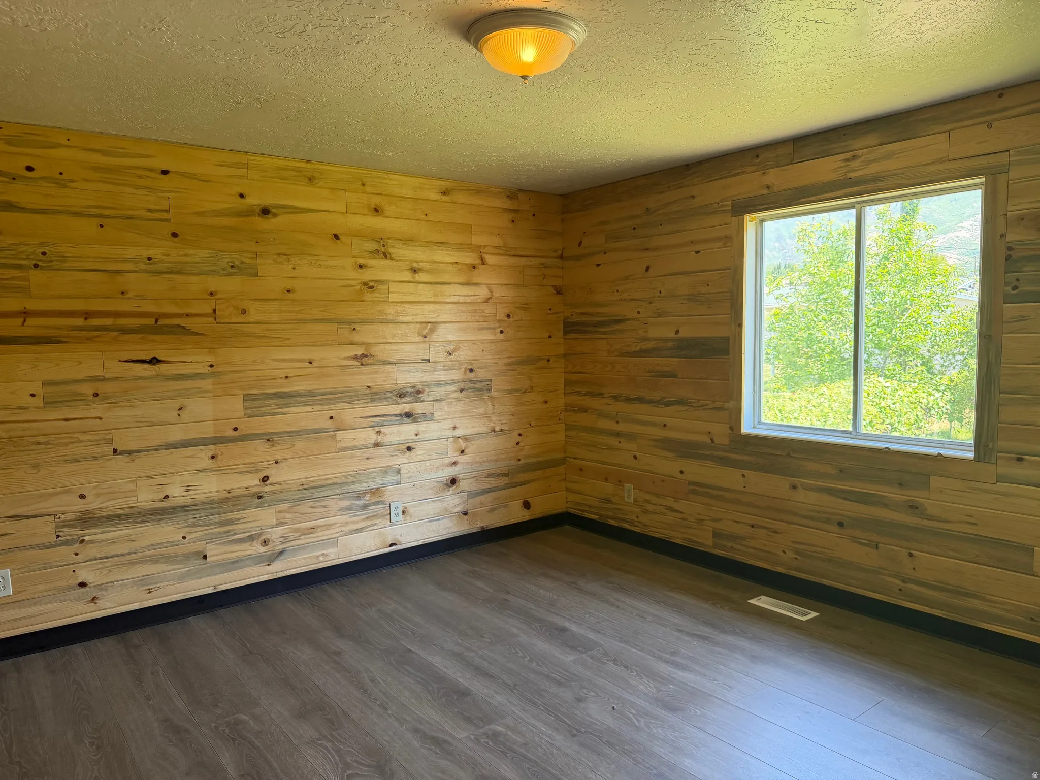 Wood-paneled accent wall with natural variations
