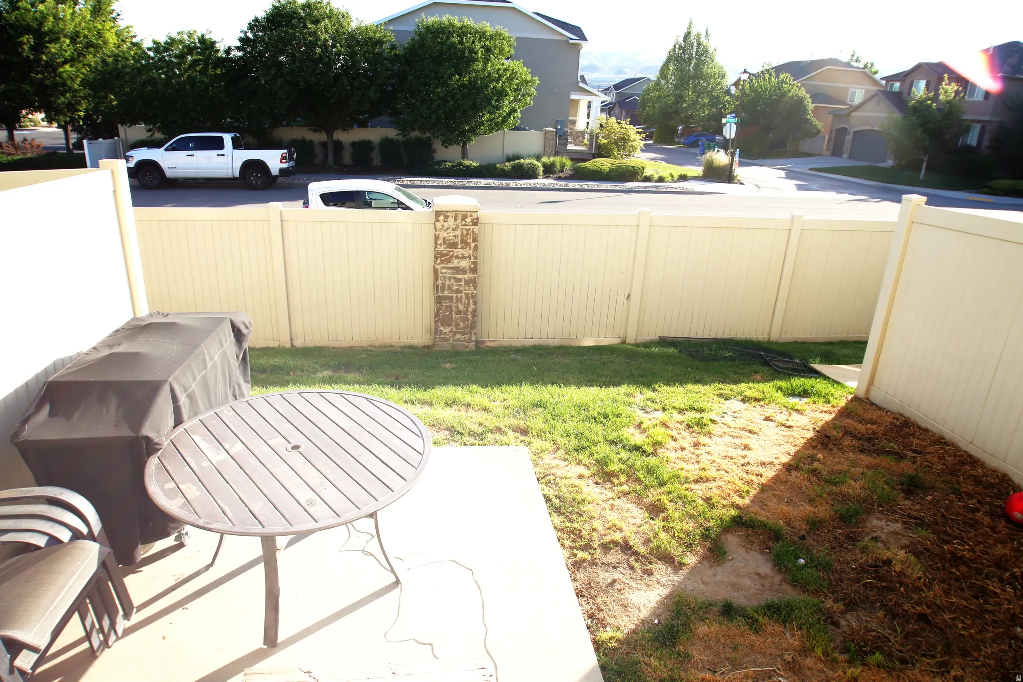 Private patio space featuring a concrete slab and a fenced perimeter