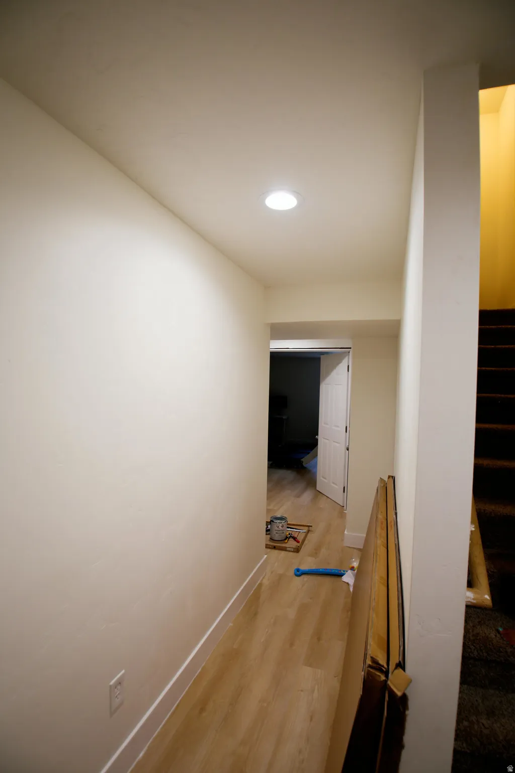 Hallway featuring wood-finish flooring and recessed ceiling lighting