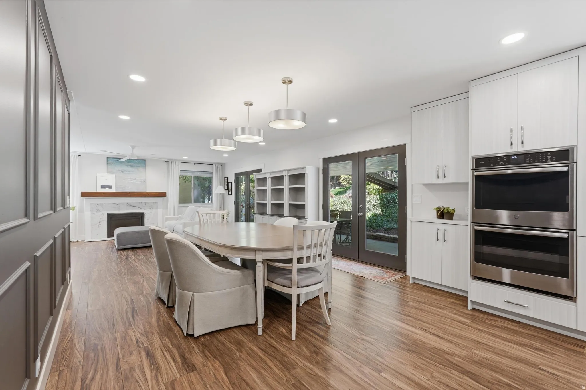 Expansive interior featuring wood-finish flooring, recessed lighting, and a neutral color palette