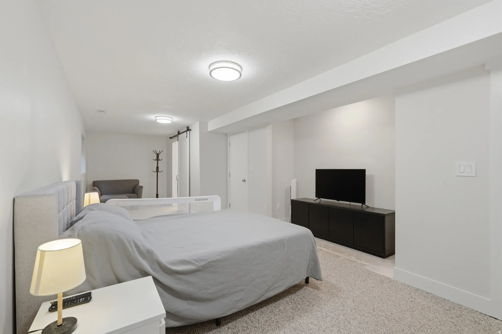 Carpeted room featuring recessed lighting and a white color palette
