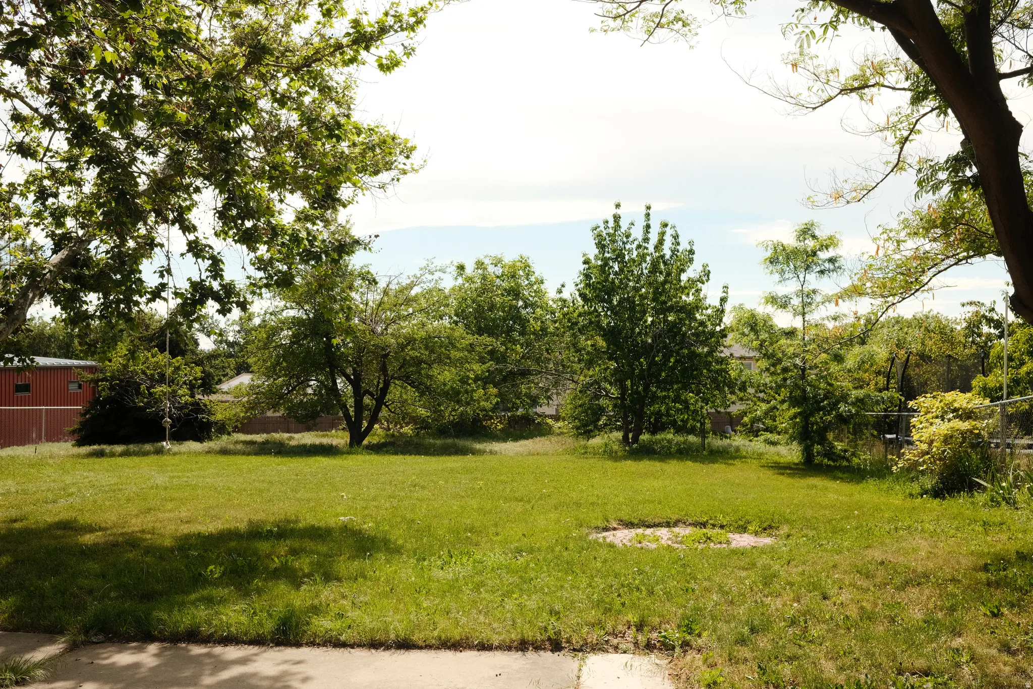 Expansive lot featuring mature trees and established green space