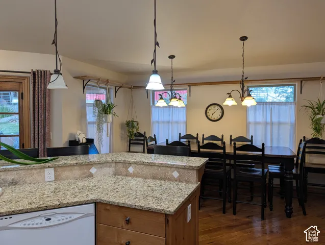 Kitchen with granite countertops and wood-finish flooring