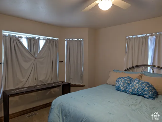 Recessed bay window with multiple individual windows and coordinating window treatments