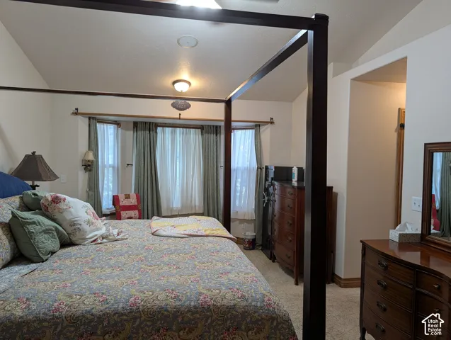 Vaulted ceilings featuring recessed lighting and a ceiling fan