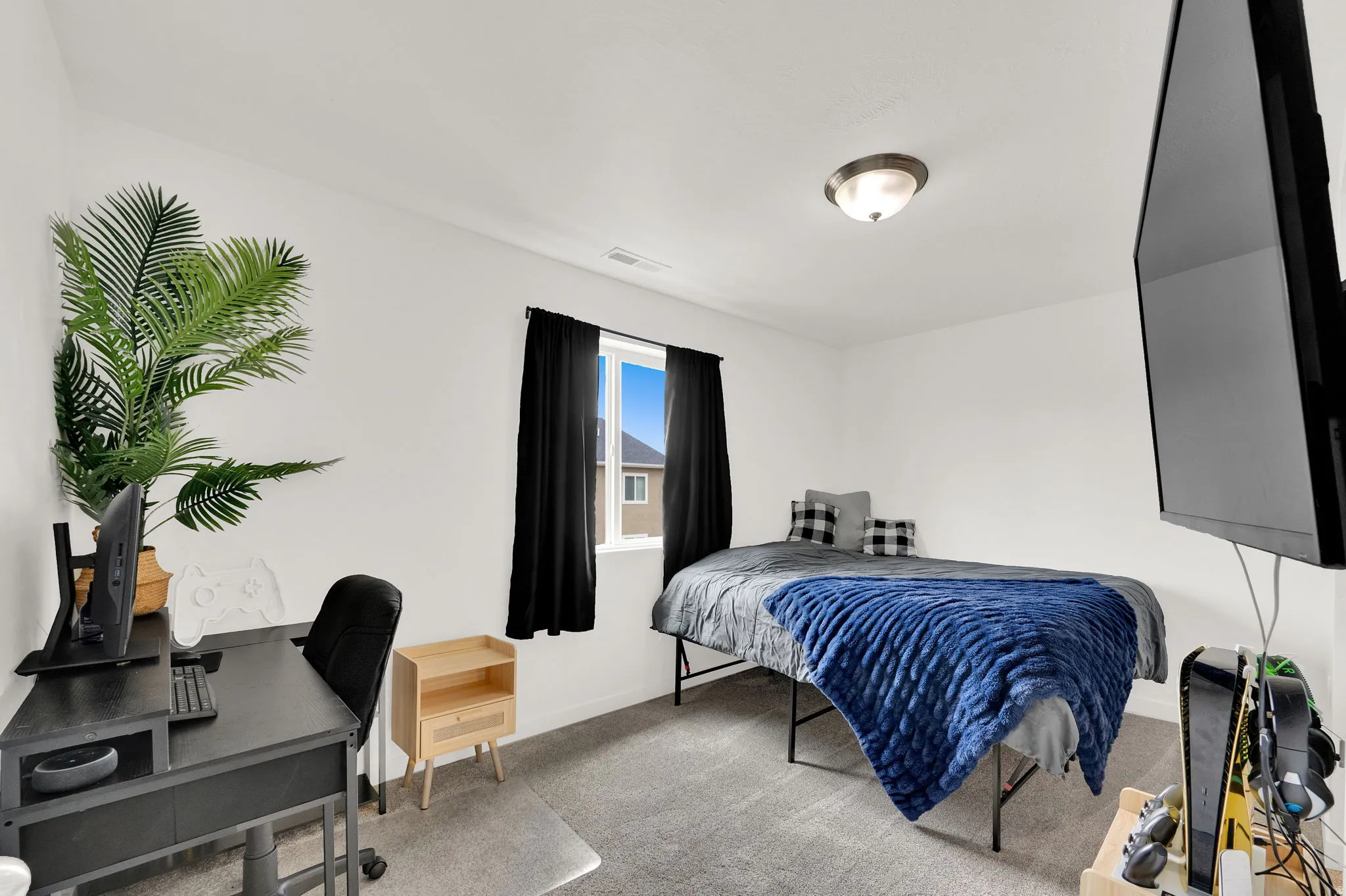 Room featuring neutral wall finishes and gray carpet flooring