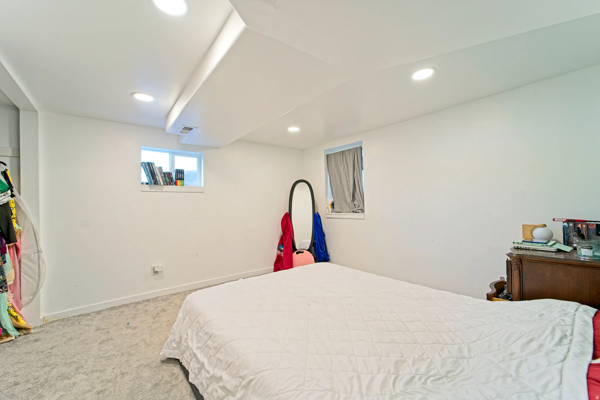 Carpeted room featuring recessed lighting and two windows