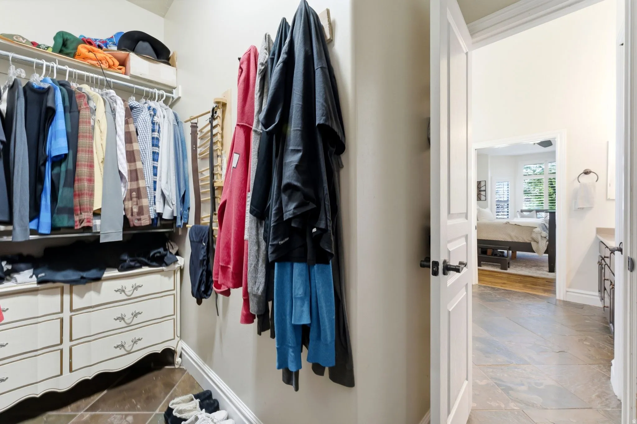 Walk-in closet featuring in the primary suite