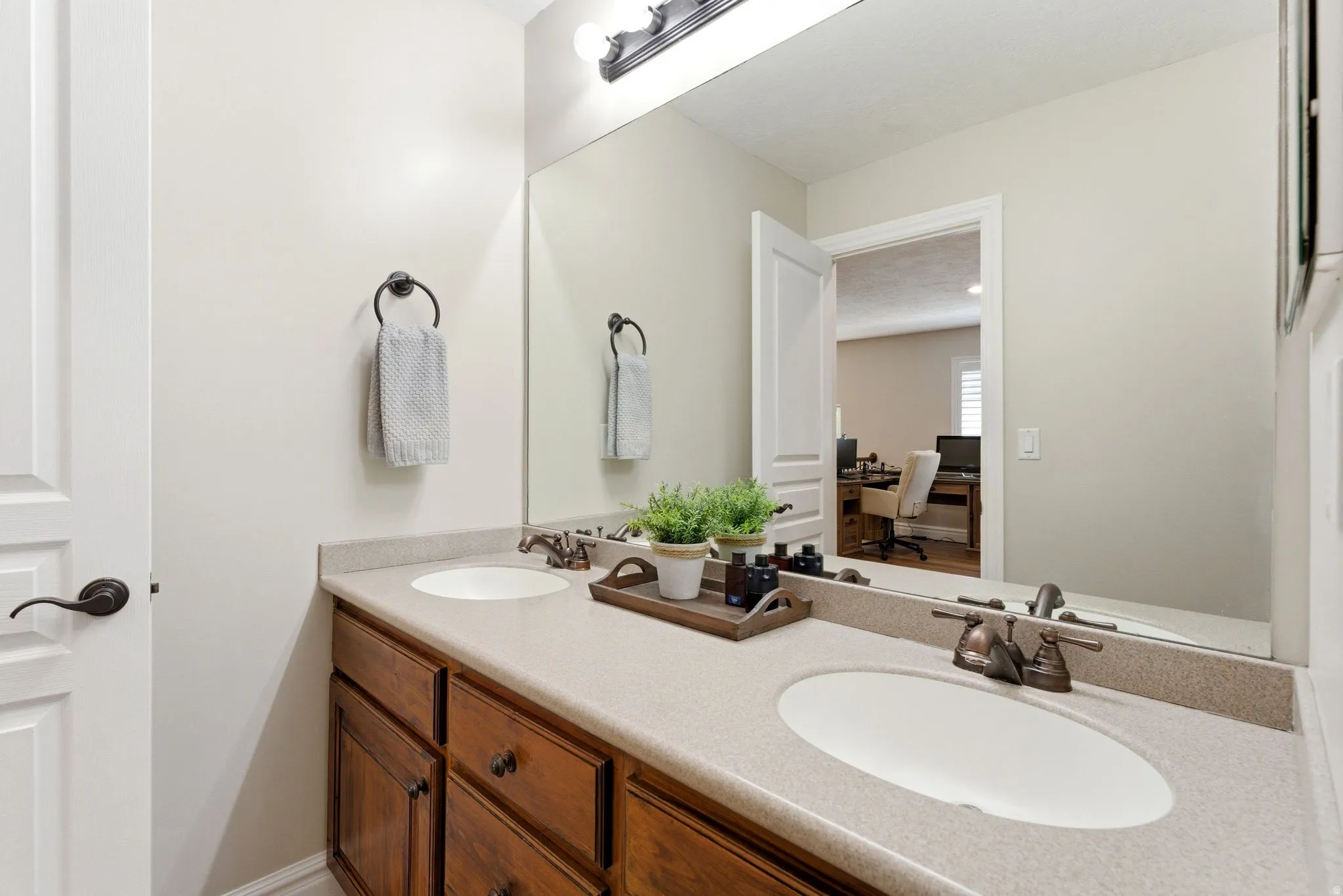 Dual vanity featuring undermount sinks in the second level full bathroom