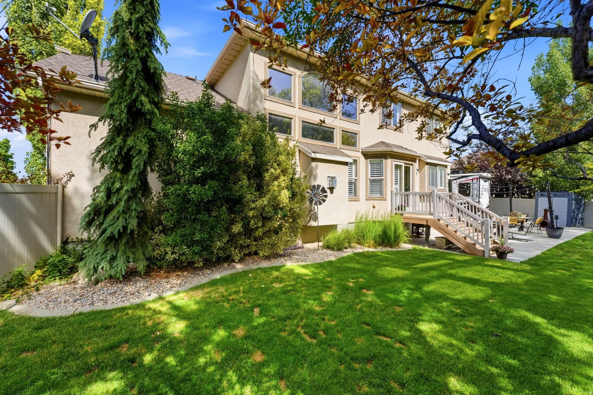 Expansive rear lawn and back vantage of the home