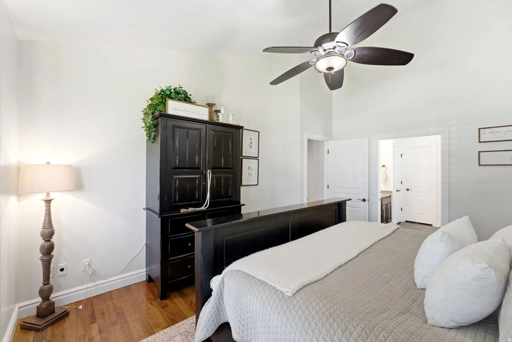 Primary bedroom featuring vaulted ceilings
