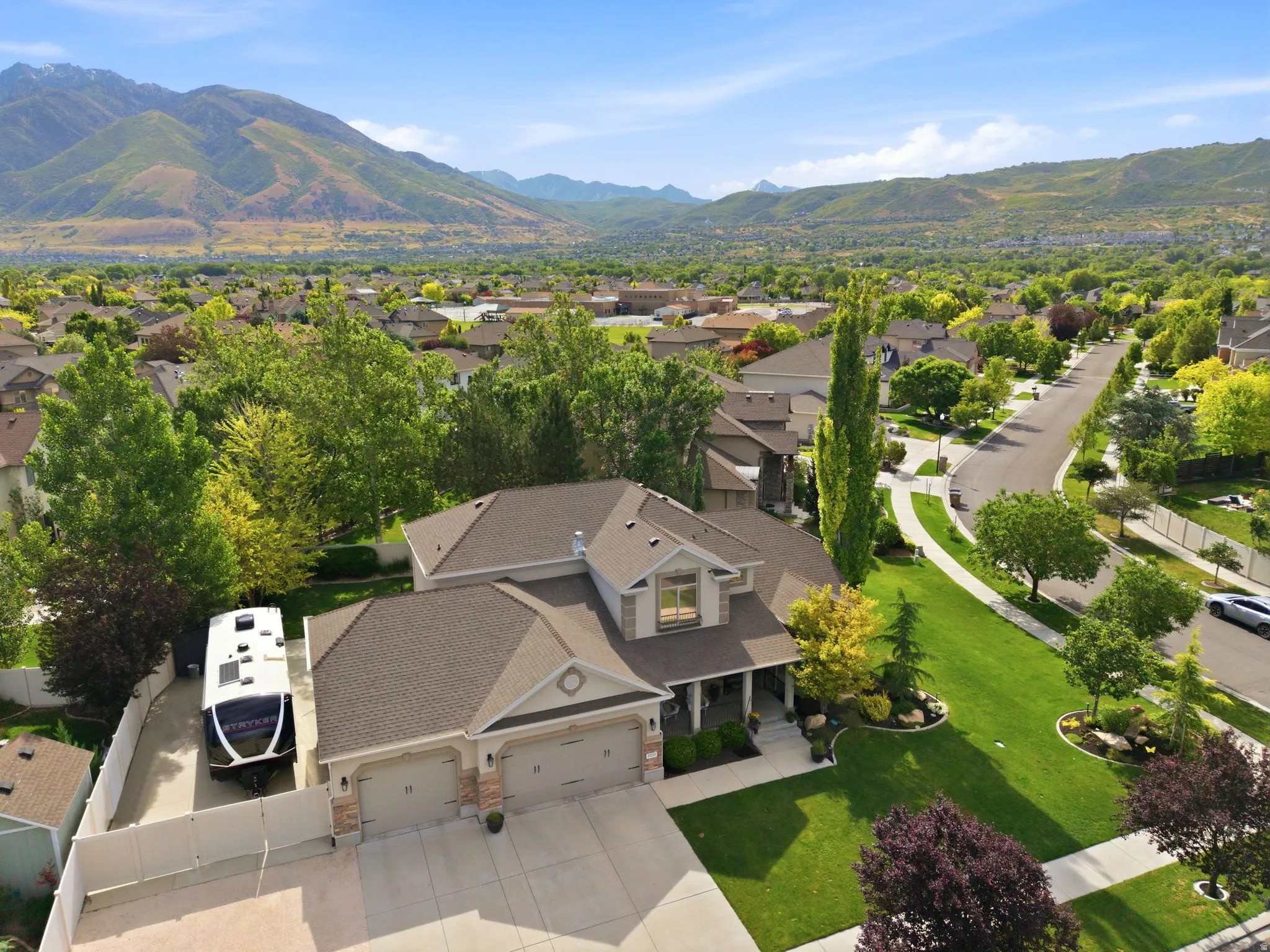 Contemporary residence featuring a three-car garage with large 20'X48' RV / multiple vehicle parking pad