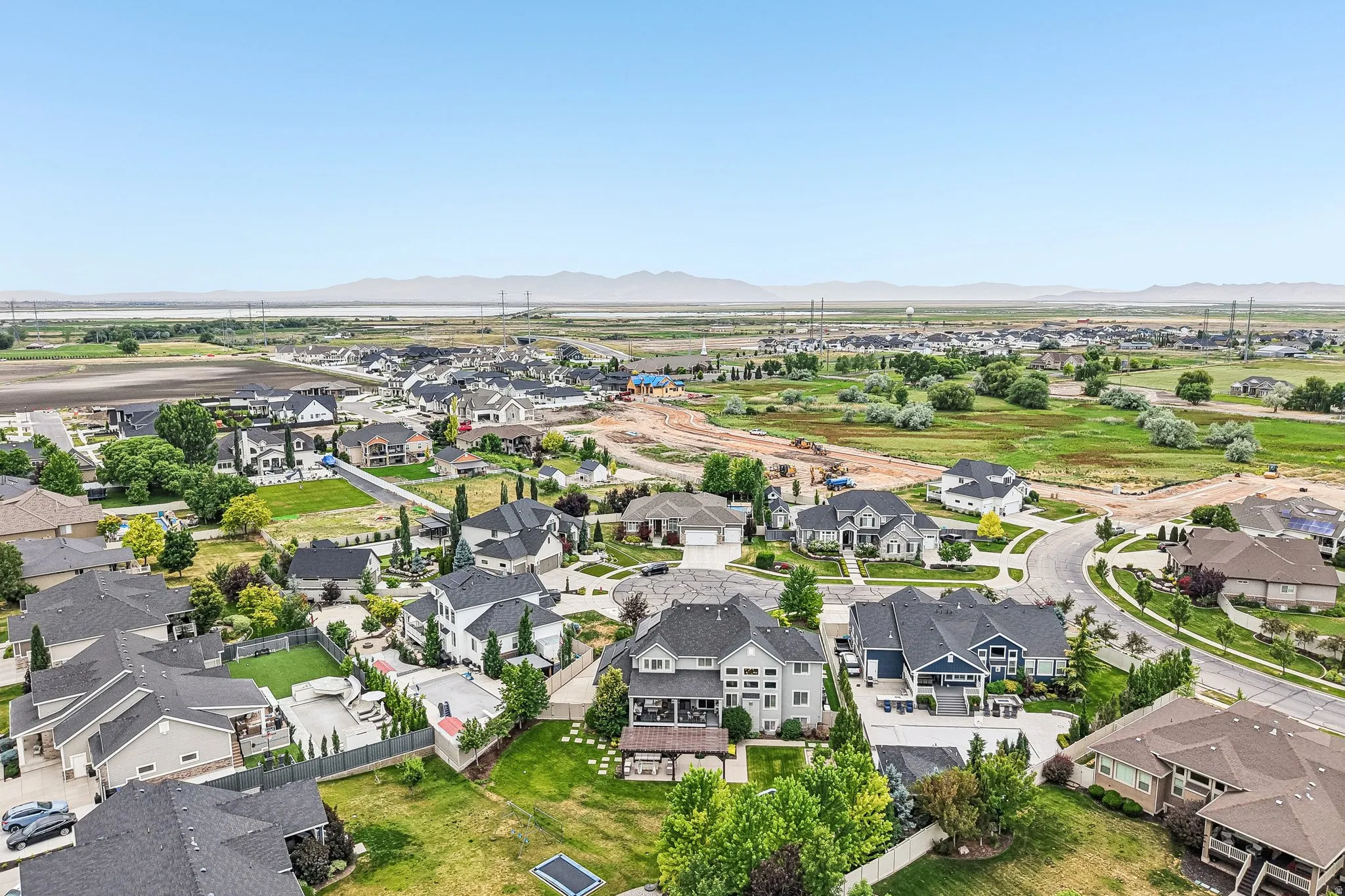 Expansive aerial perspective showcasing a residential development with varied architectural styles