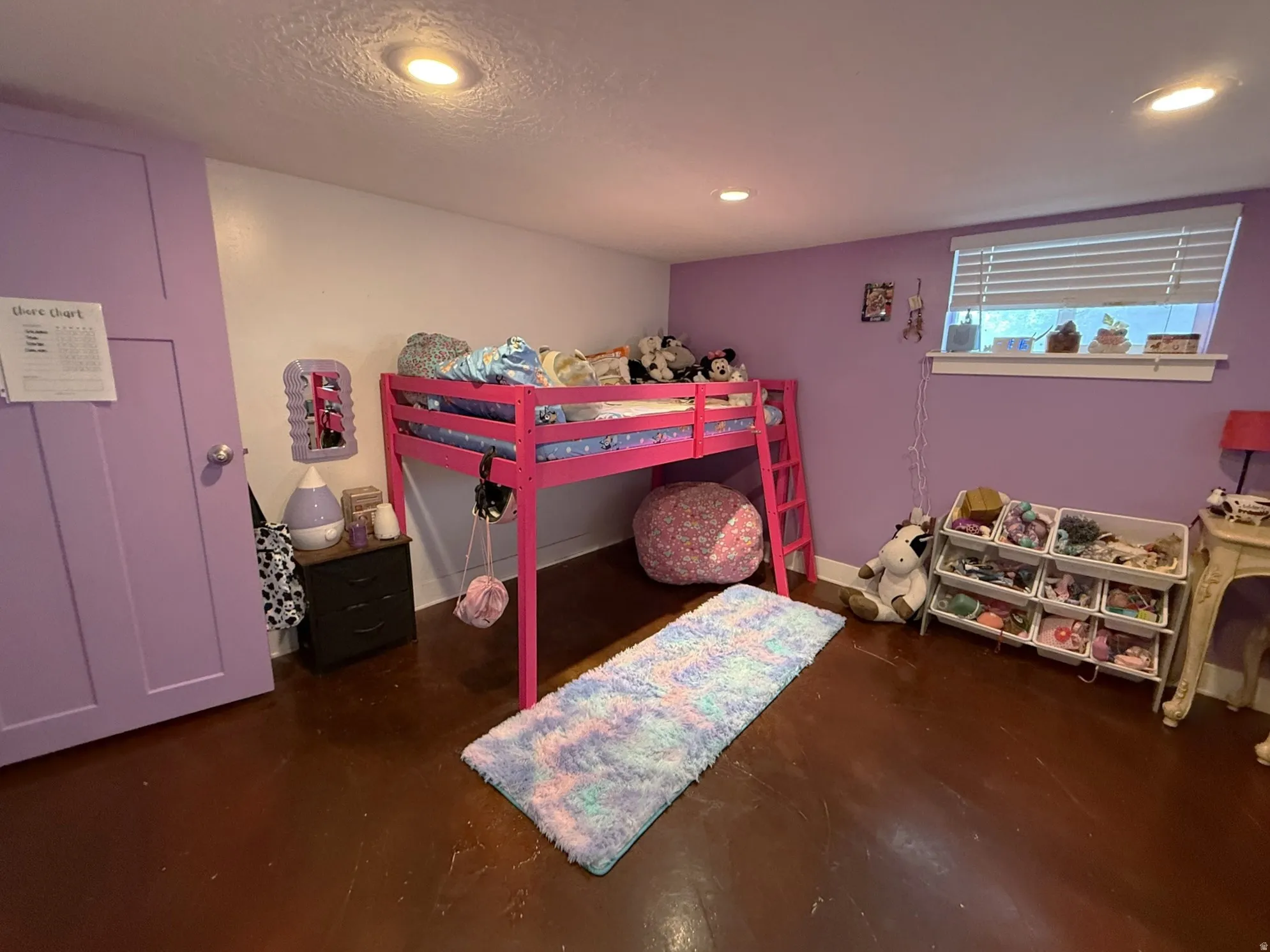 Room featuring recessed lighting, a window with horizontal blinds, and a paneled door