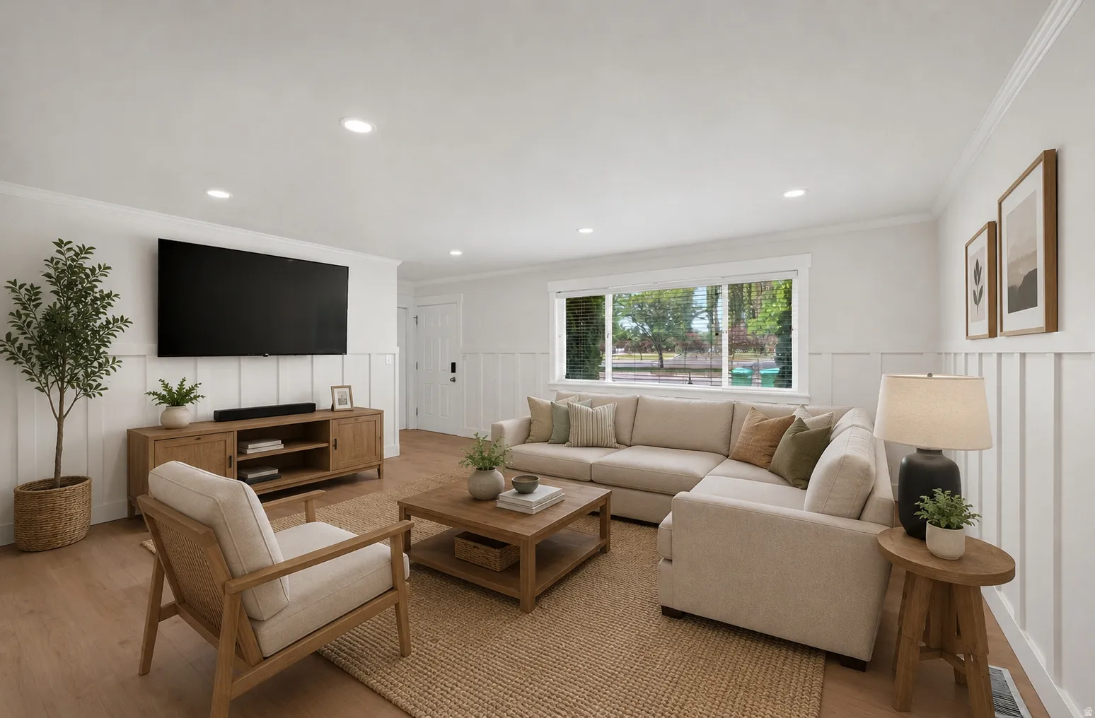 Living area featuring wood-finish flooring and white wainscoting