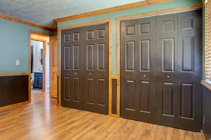 Wood-finish flooring throughout, complemented by two sets of bi-fold closet doors