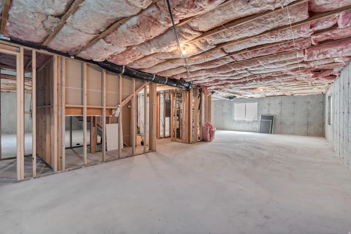 Spacious unfinished basement with windows for natural light