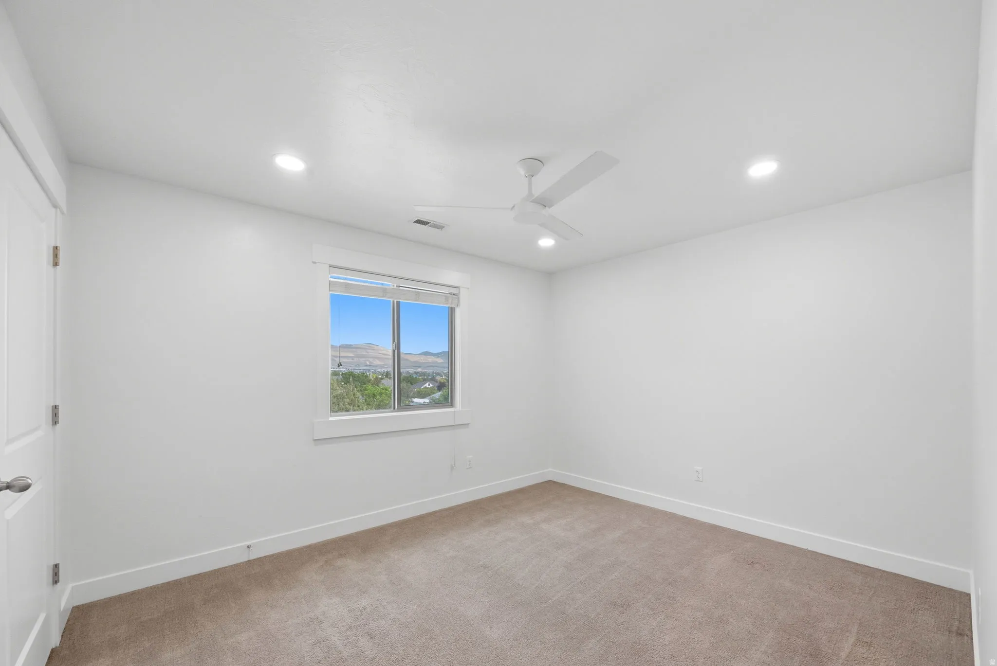 Bedroom #2 featuring a ceiling fan, and recessed lighting with walk-in closet