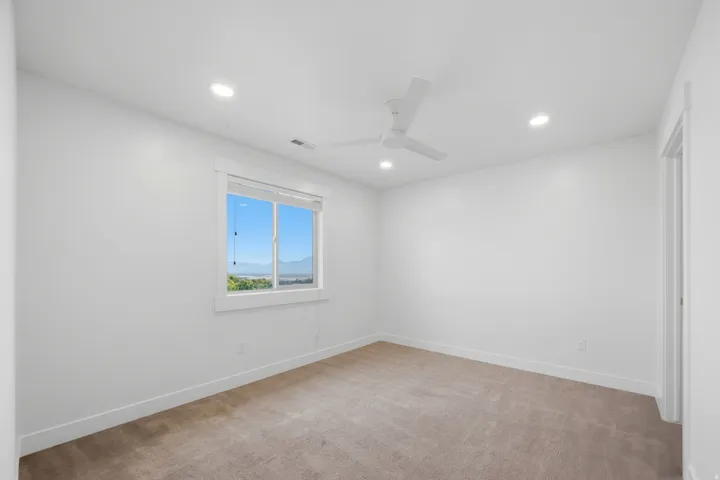 Bedroom #4  with ceiling fan, recessed lighting and walk-in closet.