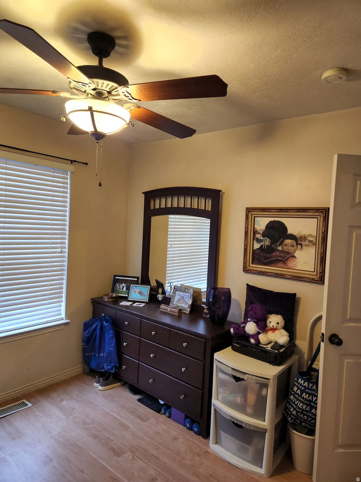 3rd bedroom with wood-finish flooring throughout