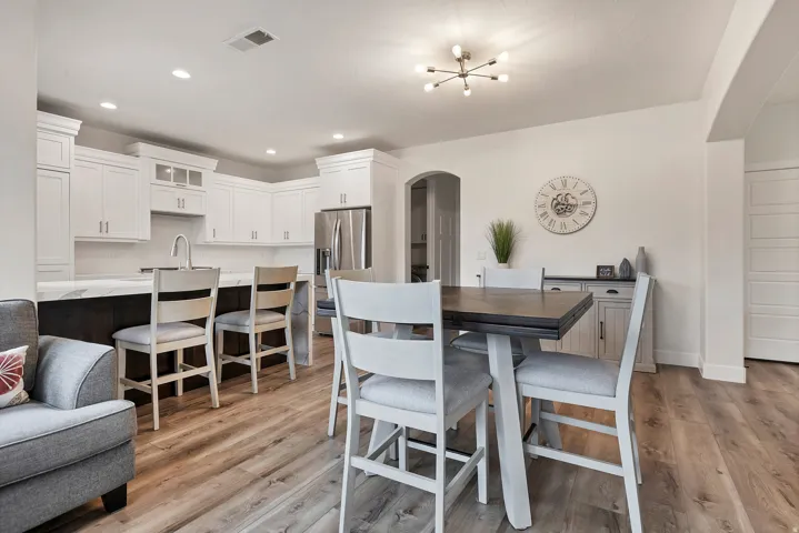 Open-concept living space featuring wood-finish flooring