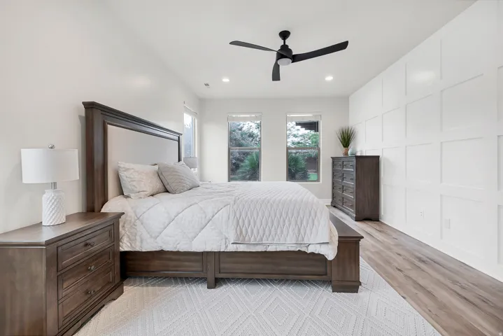 Bedroom featuring wood-finish flooring, recessed lighting, and a contemporary ceiling fan