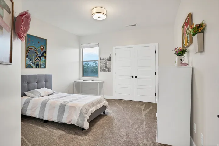 Interior room featuring neutral wall paint and plush carpet flooring
