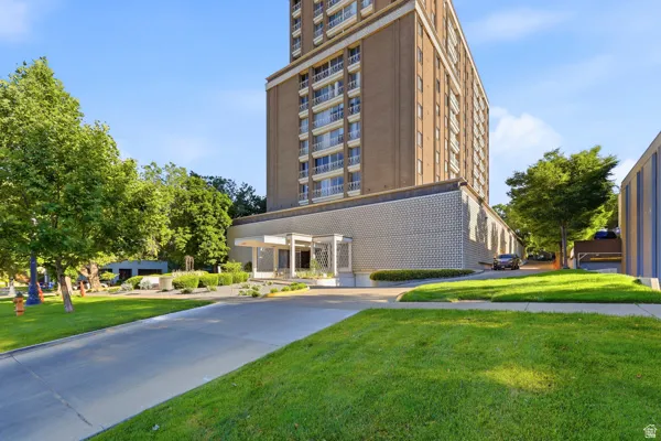 Mid-rise building featuring a brick exterior and multiple private balconies
