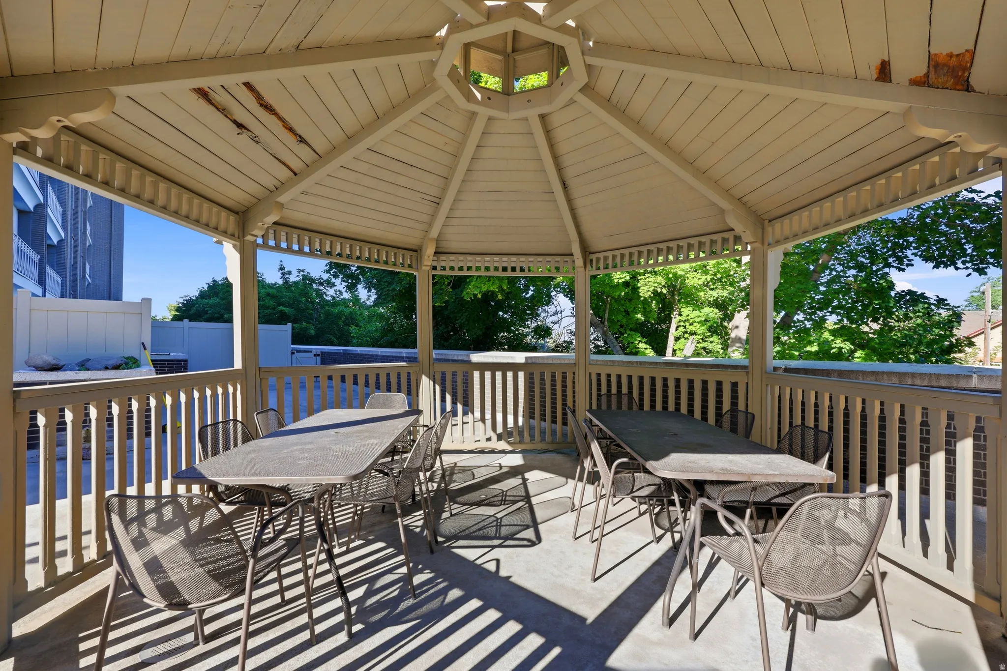 Octagonal gazebo structure with wood construction and a slatted ceiling