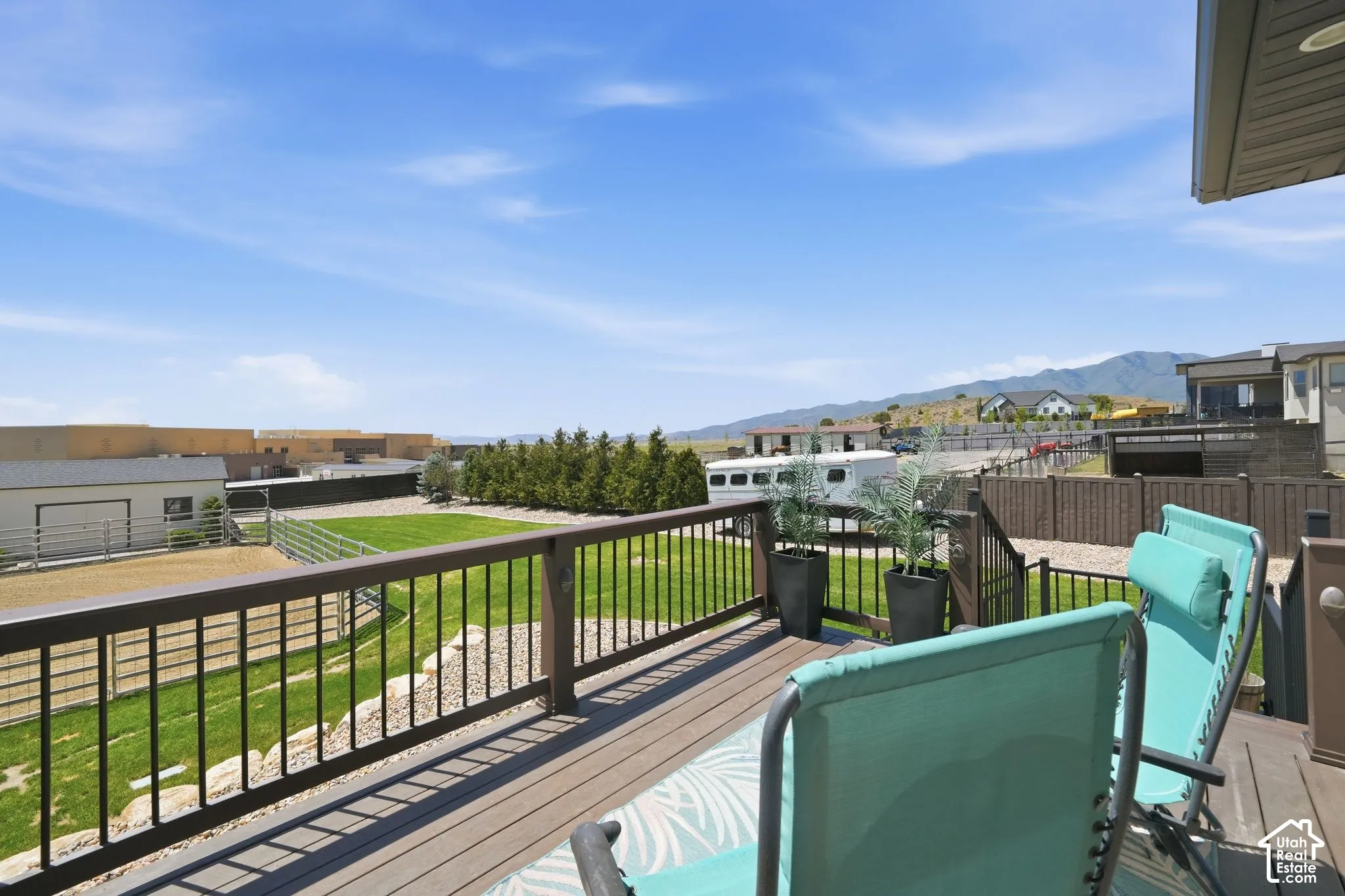 Expansive outdoor deck featuring composite decking and a black metal railing