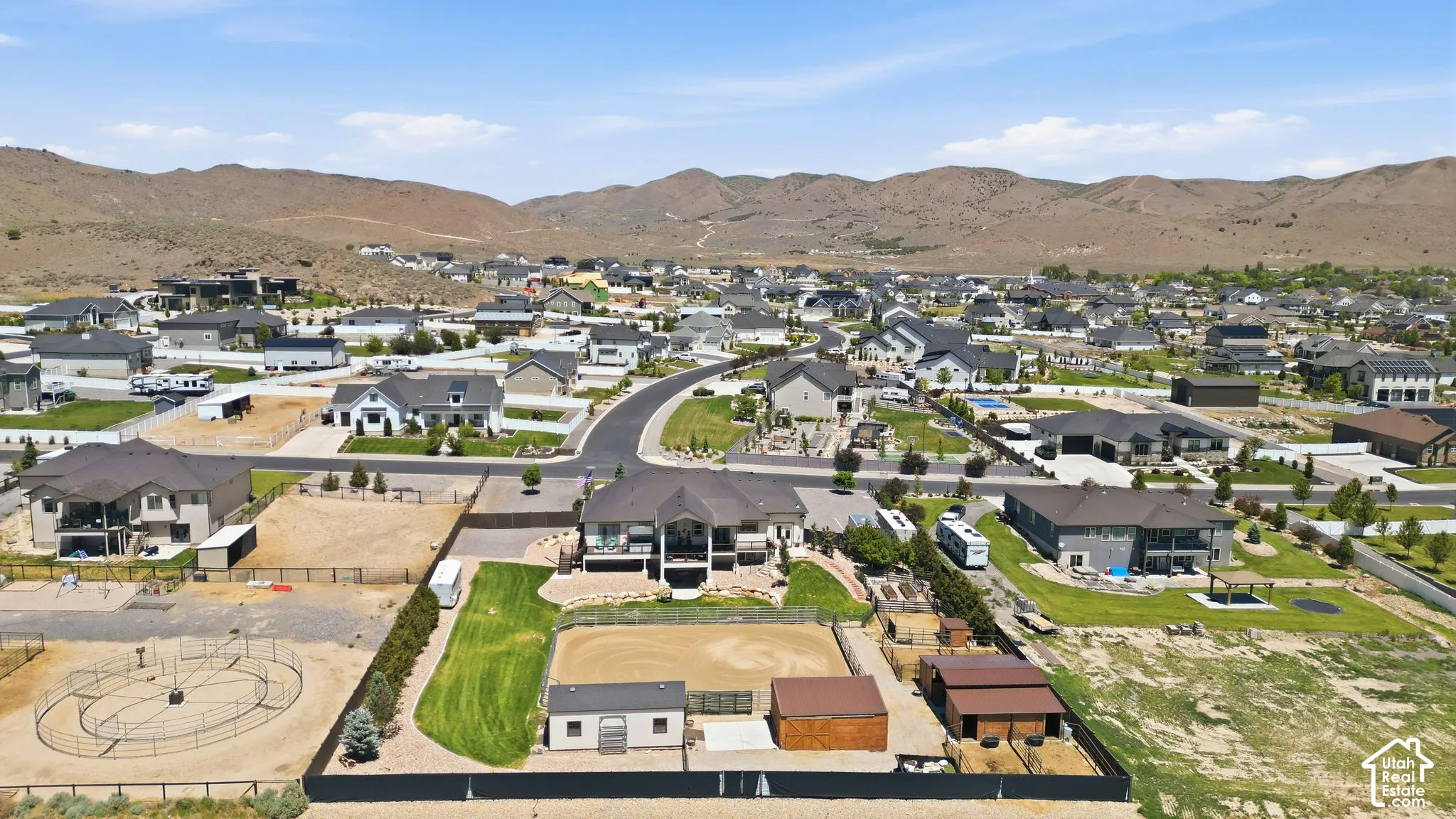 Expansive property featuring an equestrian arena, stables, and a dedicated turnout area